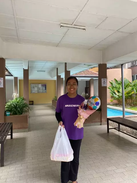 Smiling person receiving delivery